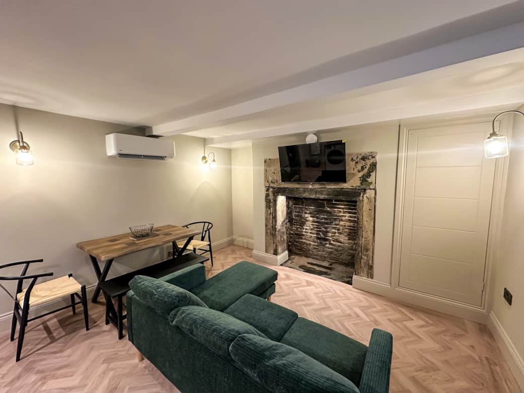 Cosy shared snug with sofa and dining area